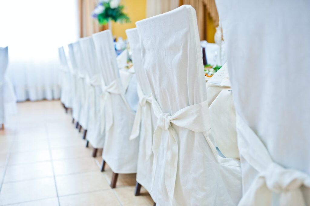 White wedding chairs on restaurant